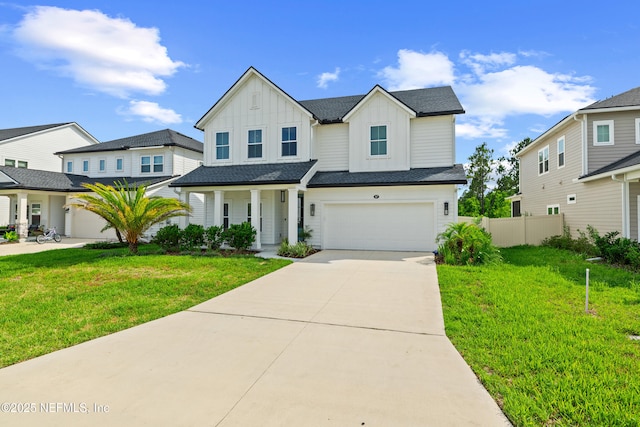 347 Ness Cir, Saint Augustine, FL 32095 - view of front facade featuring board and batten siding, concrete driveway, an attached garage, and a porch
