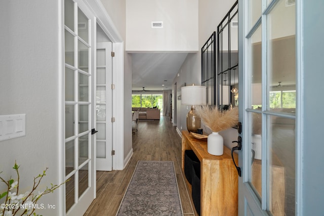 347 Ness Cir, Saint Augustine, FL 32095 - hallway with french doors and dark wood-style flooring