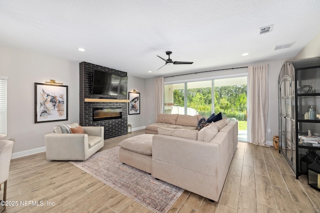 347 Ness Cir, Saint Augustine, FL 32095 - living area with wood finished floors, ceiling fan, a fireplace, and recessed lighting