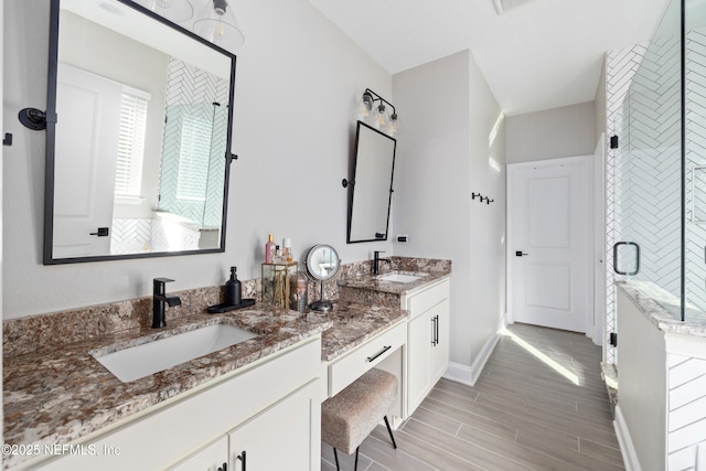 347 Ness Cir, Saint Augustine, FL 32095 - full bathroom with double vanity, wood finished floors, and a shower stall