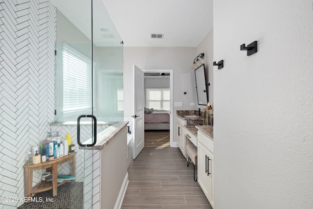 347 Ness Cir, Saint Augustine, FL 32095 - full bath with ensuite bath, wood tiled floors, vanity, and a stall shower