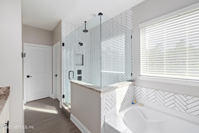 347 Ness Cir, Saint Augustine, FL 32095 - full bathroom with a shower stall, a bath, vanity, and wood finished floors