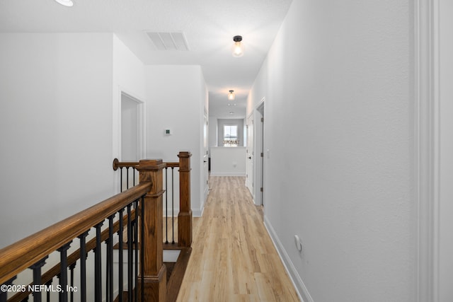 347 Ness Cir, Saint Augustine, FL 32095 - hallway featuring an upstairs landing and light wood-style flooring