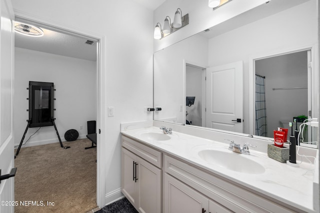 347 Ness Cir, Saint Augustine, FL 32095 - bathroom featuring double vanity and baseboards