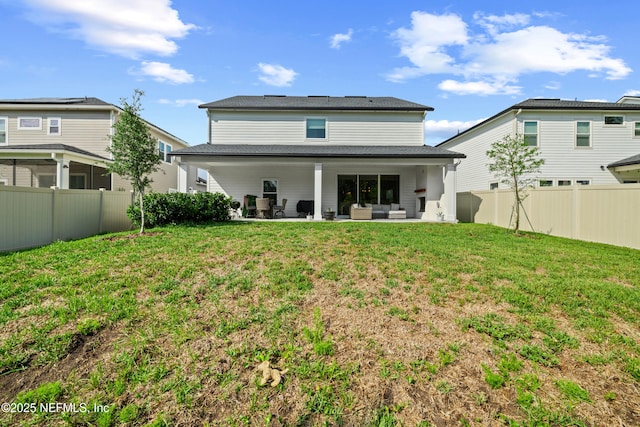 347 Ness Cir, Saint Augustine, FL 32095 - rear view of house with a fenced backyard, a patio, and outdoor lounge area