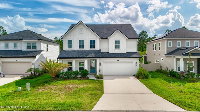 347 Ness Cir, Saint Augustine, FL 32095 - view of front of home with board and batten siding, driveway, an attached garage, covered porch, and roof with shingles