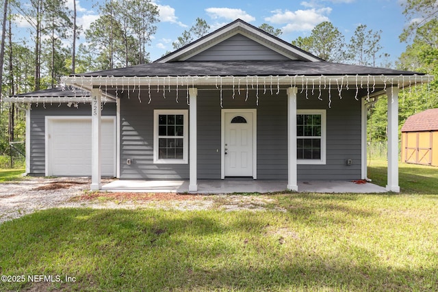 4725 Melanie St, Hastings, FL 32145 - view of front facade with a garage, driveway, a front yard, roof with shingles, and covered porch