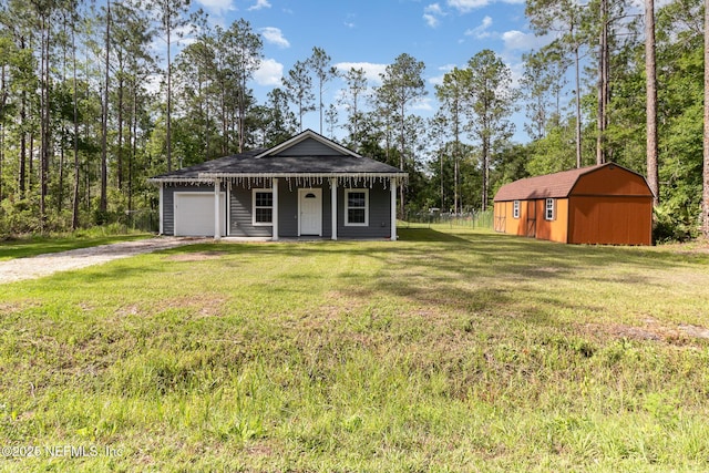 4725 Melanie St, Hastings, FL 32145 - view of front of home featuring driveway, a garage, a front yard, a storage unit, and covered porch