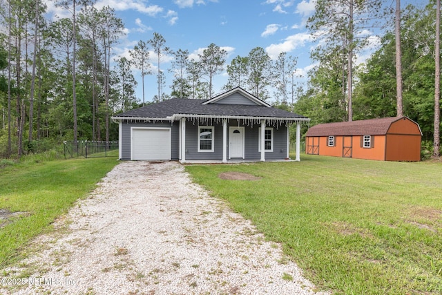 4725 Melanie St, Hastings, FL 32145 - view of front facade featuring a garage, driveway, covered porch, roof with shingles, and a storage unit