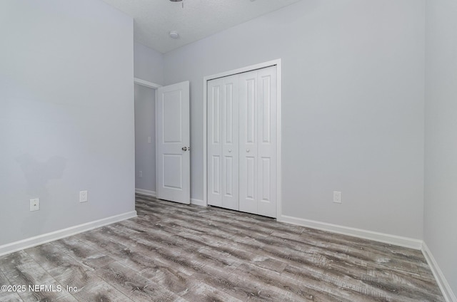 4725 Melanie St, Hastings, FL 32145 - unfurnished bedroom with wood finished floors and a closet