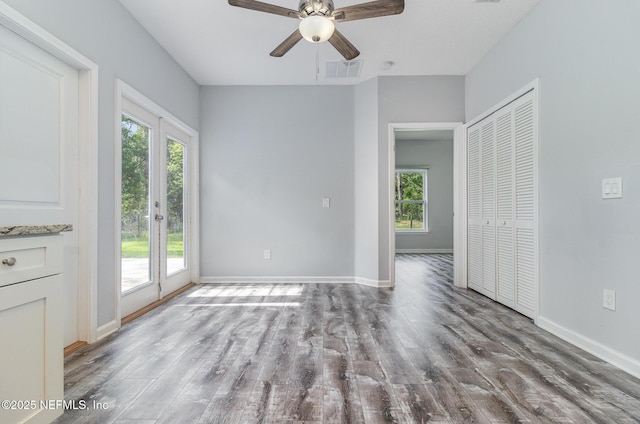4725 Melanie St, Hastings, FL 32145 - unfurnished living room featuring wood finished floors and ceiling fan