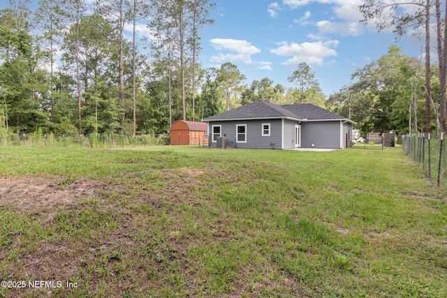 4725 Melanie St, Hastings, FL 32145 - rear view of house with a fenced backyard and a storage shed