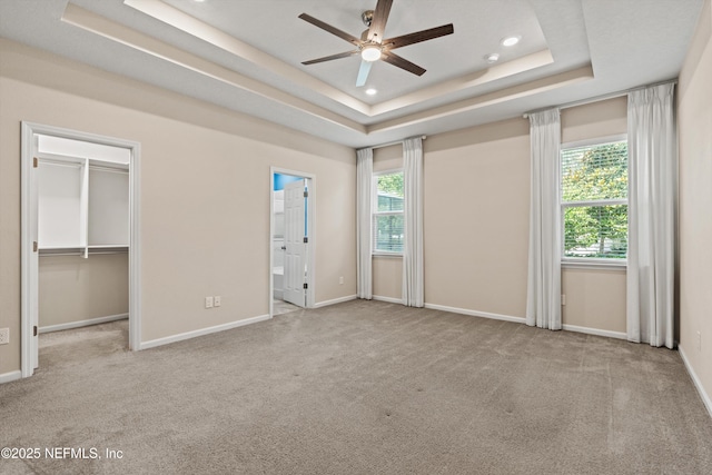 12206 Orange Grove Dr, Jacksonville, FL 32223 - unfurnished bedroom with multiple windows, carpet flooring, a raised ceiling, and recessed lighting