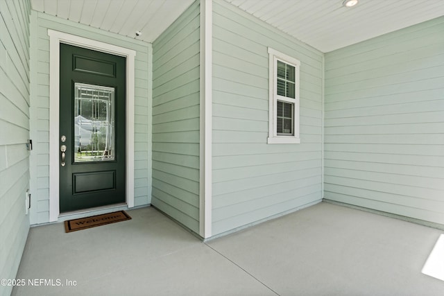 12206 Orange Grove Dr, Jacksonville, FL 32223 - entrance to property with covered porch and a surveillance system