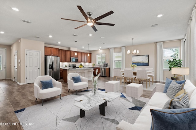 12206 Orange Grove Dr, Jacksonville, FL 32223 - living area featuring plenty of natural light, recessed lighting, ceiling fan, and a chandelier