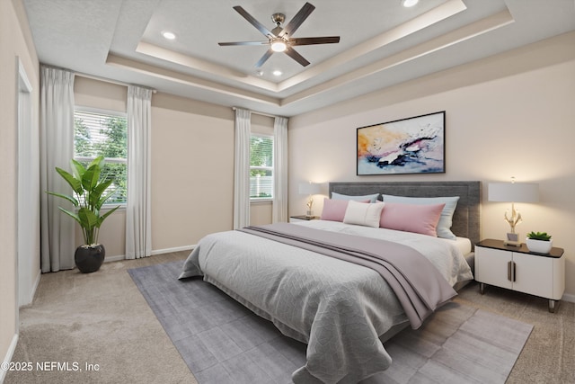 12206 Orange Grove Dr, Jacksonville, FL 32223 - carpeted bedroom featuring recessed lighting, a tray ceiling, and a ceiling fan