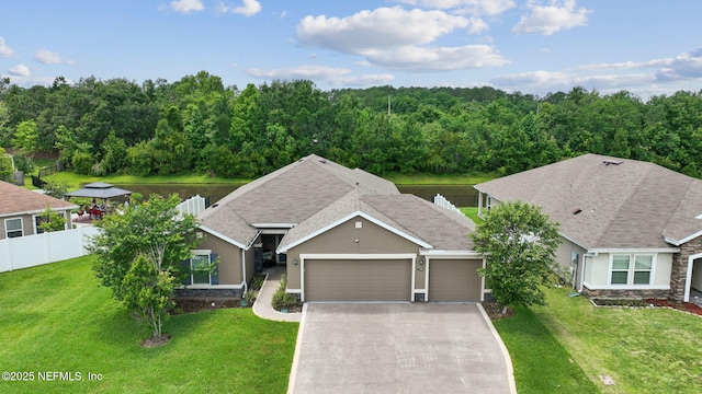 7250 Steventon Way, Jacksonville, FL 32244 - ranch-style home featuring an attached garage, concrete driveway, stone siding, and stucco siding
