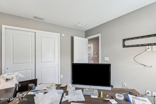 7250 Steventon Way, Jacksonville, FL 32244 - home office featuring a textured ceiling