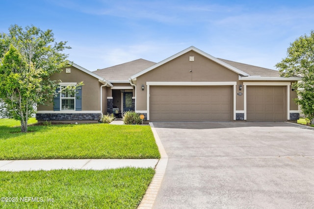 7250 Steventon Way, Jacksonville, FL 32244 - view of front of house with stucco siding, an attached garage, stone siding, a front lawn, and concrete driveway