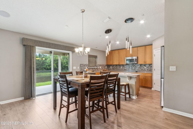 7250 Steventon Way, Jacksonville, FL 32244 - dining space with light wood-style floors, a chandelier, and recessed lighting