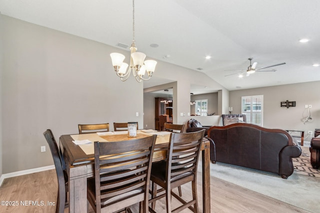 7250 Steventon Way, Jacksonville, FL 32244 - dining room with light wood-type flooring, a ceiling fan, a chandelier, vaulted ceiling, and recessed lighting