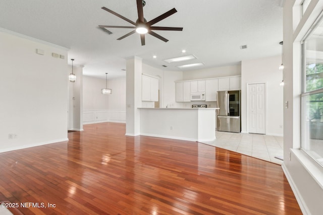 1912 Bluebonnet Way, Fleming Island, FL 32003 - unfurnished living room featuring light wood finished floors, ceiling fan, and recessed lighting
