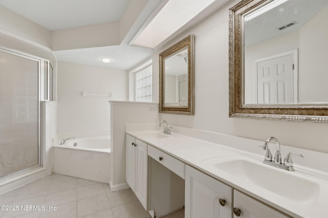 1912 Bluebonnet Way, Fleming Island, FL 32003 - full bathroom with a bath, a stall shower, double vanity, and tile patterned flooring