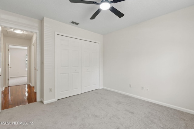 1912 Bluebonnet Way, Fleming Island, FL 32003 - unfurnished bedroom featuring carpet, a closet, and a ceiling fan