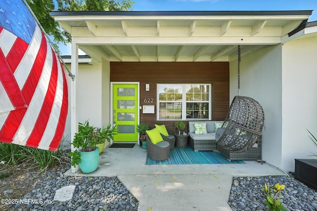 622 7th Ave N, Jacksonville Beach, FL 32250 - property entrance with covered porch and stucco siding