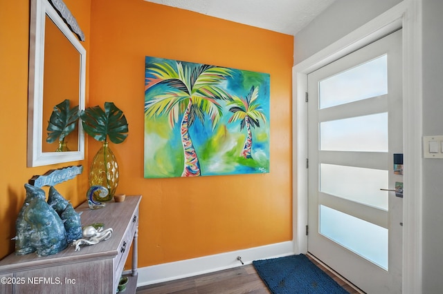 622 7th Ave N, Jacksonville Beach, FL 32250 - doorway with baseboards and wood finished floors