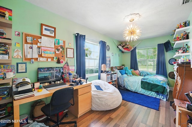 622 7th Ave N, Jacksonville Beach, FL 32250 - bedroom with wood finished floors and an office area