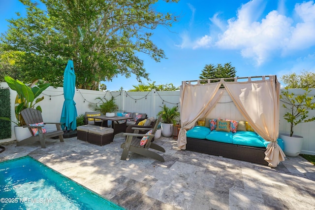 622 7th Ave N, Jacksonville Beach, FL 32250 - fenced backyard featuring a patio area, an outdoor hangout area, and outdoor dining space