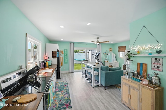 622 7th Ave N, Jacksonville Beach, FL 32250 - living room featuring light wood finished floors, ceiling fan, and recessed lighting