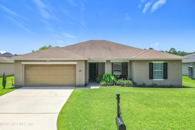 78151 Duckwood Trl, Yulee, FL 32097 - ranch-style home featuring a garage, stucco siding, and a front yard