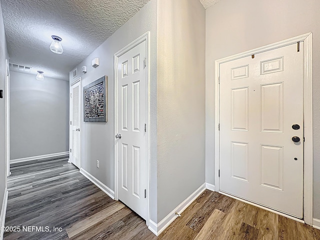 78151 Duckwood Trl, Yulee, FL 32097 - entrance foyer with wood finished floors and a textured ceiling