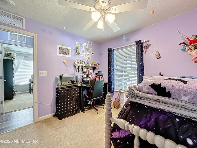 78151 Duckwood Trl, Yulee, FL 32097 - bedroom with carpet floors, a desk, multiple windows, a ceiling fan, and a textured ceiling