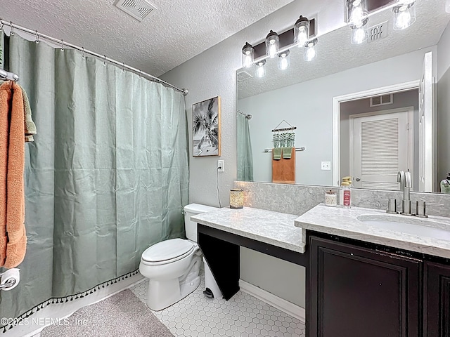 78151 Duckwood Trl, Yulee, FL 32097 - full bath featuring vanity, a textured ceiling, a shower with shower curtain, and tile patterned flooring