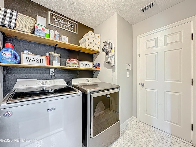 78151 Duckwood Trl, Yulee, FL 32097 - washroom featuring independent washer and dryer and a textured ceiling
