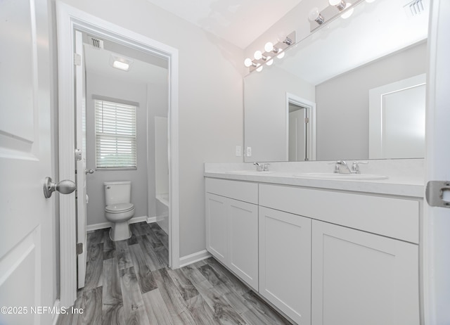 154 Moorcroft Way, Saint Augustine, FL 32092 - bathroom with double vanity, bathtub / shower combination, and wood finished floors