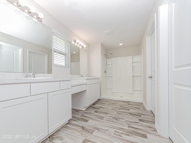 154 Moorcroft Way, Saint Augustine, FL 32092 - full bath with double vanity, a shower, and wood finished floors