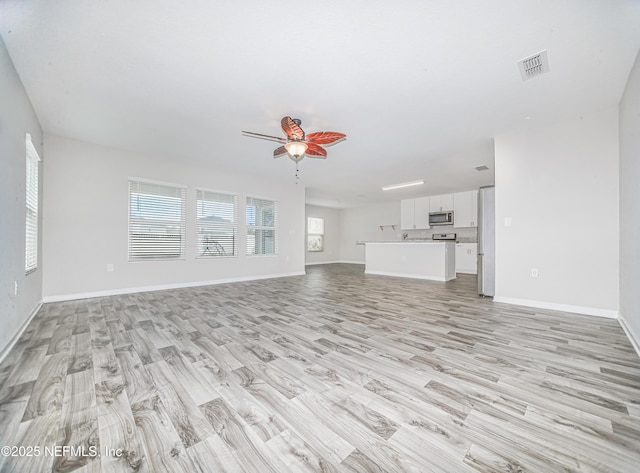 154 Moorcroft Way, Saint Augustine, FL 32092 - unfurnished living room with light wood-type flooring and ceiling fan
