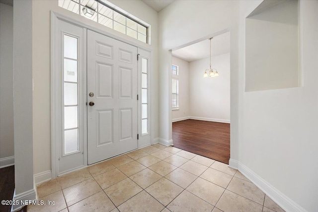 409 Spring Ridge Ct, Saint Augustine, FL 32092 - entrance foyer with a chandelier and light tile patterned floors