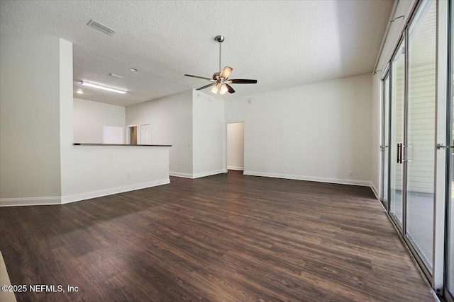 409 Spring Ridge Ct, Saint Augustine, FL 32092 - unfurnished living room with wood finished floors, a ceiling fan, and a textured ceiling