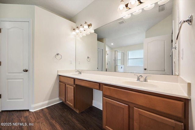 409 Spring Ridge Ct, Saint Augustine, FL 32092 - bathroom with wood finished floors, double vanity, and an enclosed shower