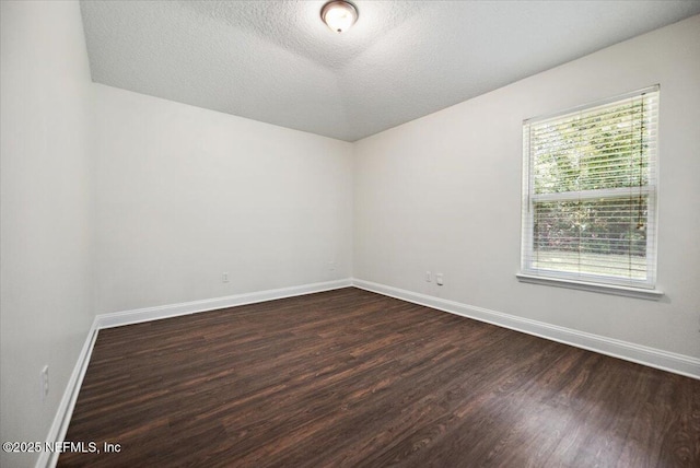 409 Spring Ridge Ct, Saint Augustine, FL 32092 - unfurnished room with dark wood finished floors and a textured ceiling