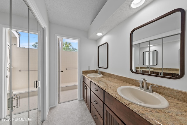 511 Selva Lakes Cir, Atlantic Beach, FL 32233 - full bath with double vanity, a textured ceiling, a shower with shower door, and recessed lighting