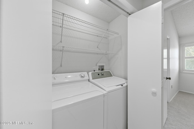 511 Selva Lakes Cir, Atlantic Beach, FL 32233 - laundry area with washing machine and dryer, a textured ceiling, and light carpet