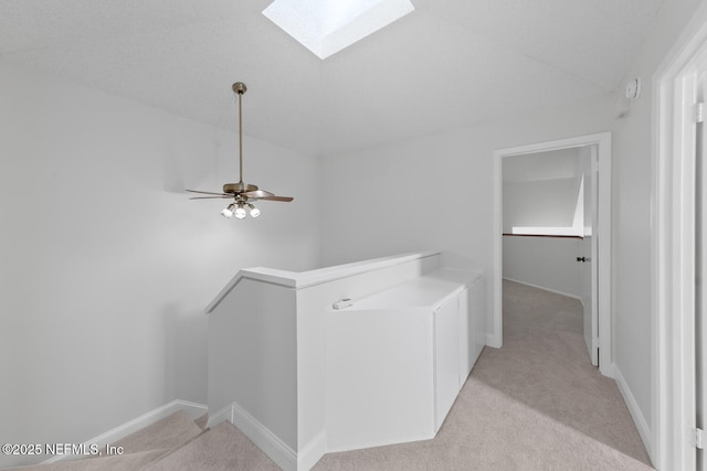 511 Selva Lakes Cir, Atlantic Beach, FL 32233 - hallway featuring an upstairs landing, a skylight, and light carpet