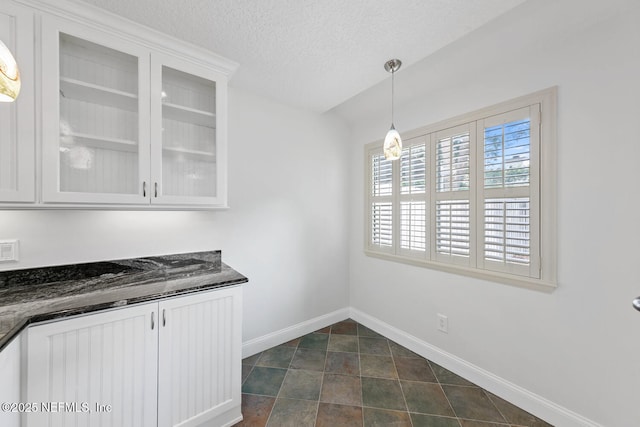 511 Selva Lakes Cir, Atlantic Beach, FL 32233 - unfurnished dining area featuring baseboards and a textured ceiling