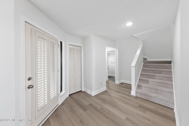 511 Selva Lakes Cir, Atlantic Beach, FL 32233 - entrance foyer with wood finished floors, stairs, a textured ceiling, and recessed lighting